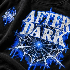 Close-up of white and electric blue web lines crossing the AFTER DARK letters