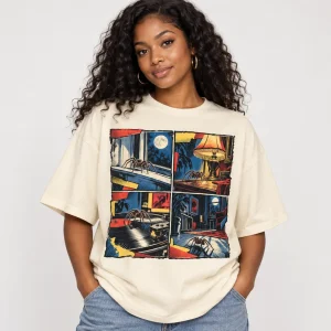 Black woman wearing cream oversized After Midnight Comics vintage spider comic shirt in a studio
