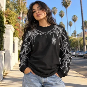 Lifestyle view of Arm Web System black spider web long sleeve shirt worn outdoors with sleeve print visible