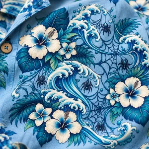 Close-up of Blue Lagoon Web print showing fabric texture, aqua waves, cream flowers, spider webs and small spiders