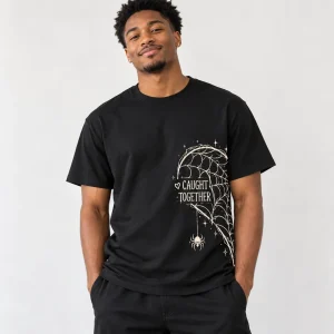 Model wearing black Couple Web Left spider Halloween couple shirt with cream side web artwork