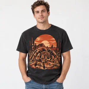 White male model wearing faded black Desert Tarantula tarantula shirt with large Southwestern spider graphic