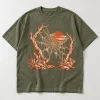 Front flat lay of faded olive Desert Web desert spider web shirt