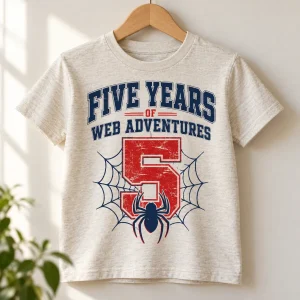 Folded Heather oatmeal Five Years Of Webs 5 year old spider shirt with front birthday graphic visible