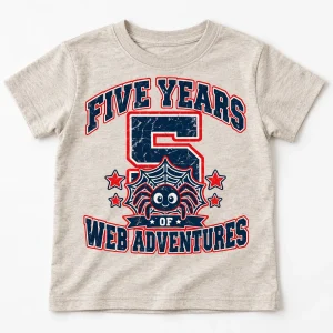 Child model wearing Heather oatmeal Five Years Of Webs 5 year old spider shirt with spider and web crest