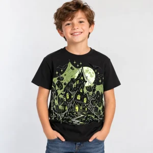 Youth model wearing Black Glow Haunted Web shirt with haunted house, spider webs, bats and stars