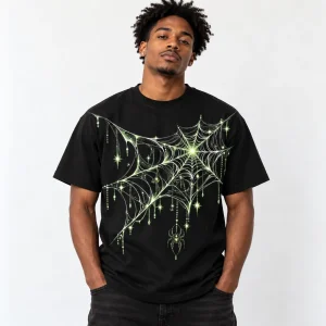 Black American male model wearing the black Glow Midnight Web spider web shirt with oversized chest print