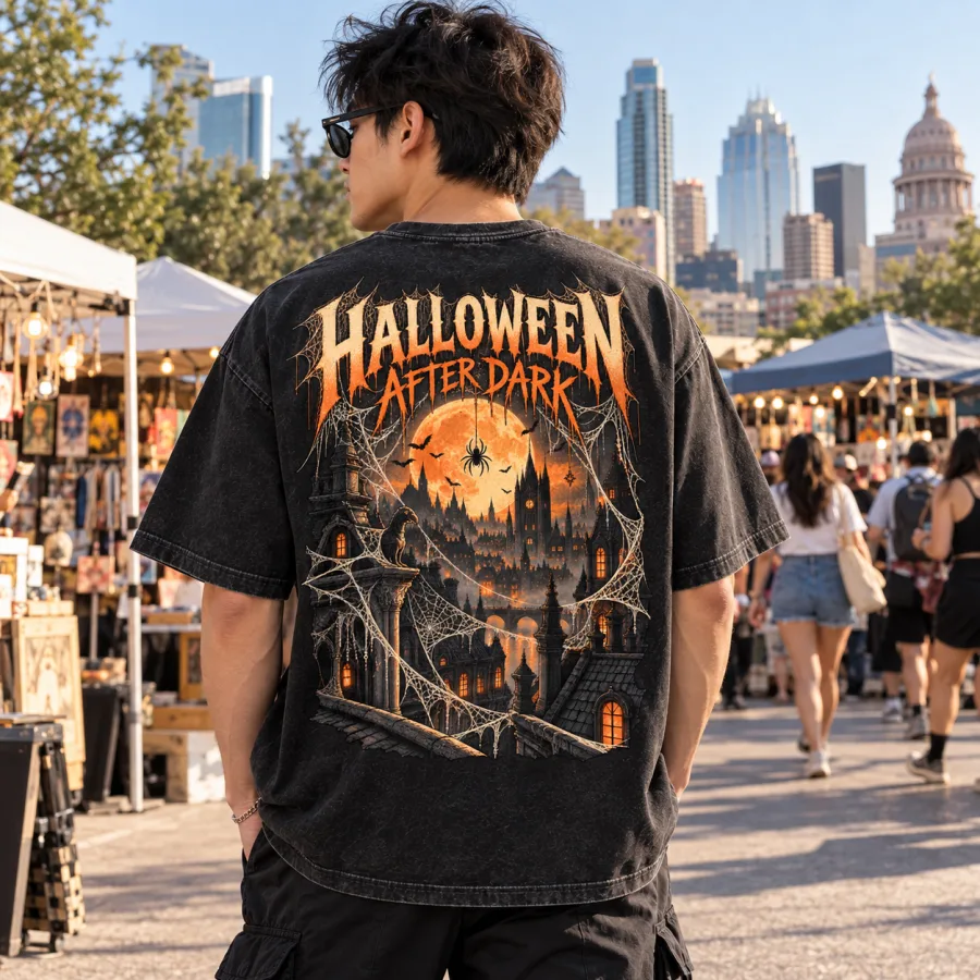 Back view of Haunted City Web oversized tee showing HALLOWEEN AFTER DARK moonlit city and giant web print