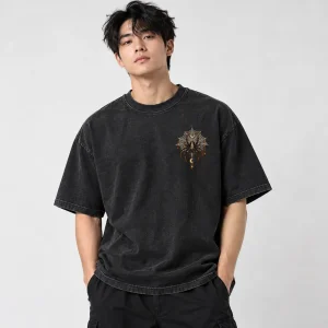Model wearing the washed black oversized Haunted City Web tee with the small front chest spider visible
