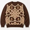 Front flat lay of chocolate brown Knit Web Illusion spider web sweater with cream and brown faux knitted orb-web print