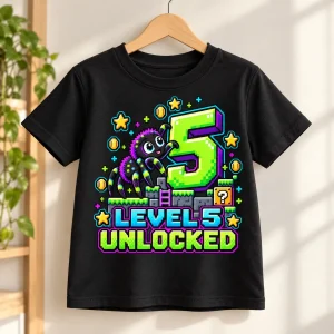 Folded Black Kids Level 5 Crawler spider 5th birthday shirt showing the bright arcade-style front graphic