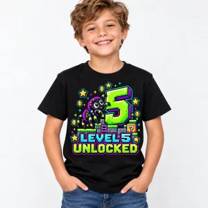 Black Kids Level 5 Crawler birthday tee displayed on a wooden hanger with colorful pixel spider print