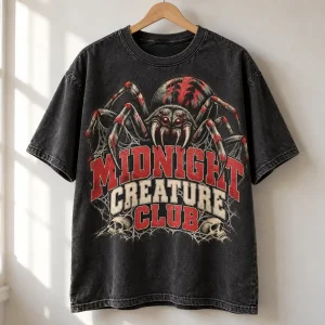 Washed black Midnight Creature Club tee on a metal hanger