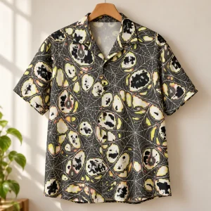 Midnight Orb Repeat spider web button up shirt hanging on a wooden hanger with all-over cream web pattern visible