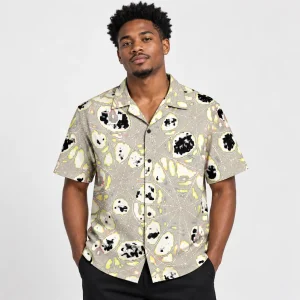 Model wearing Midnight Orb Repeat black camp collar spider web button up shirt with cream repeating web artwork
