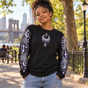 Lifestyle view of woman wearing Moon Web Arms celestial spider long sleeve shirt with moon-phase and web sleeve graphics