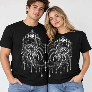 Young couple wearing black Night Crawler Couple matching spider tees with inward-facing spiders and aligned celestial webs