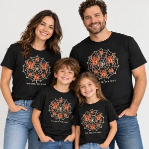 Family wearing black Our Web Family matching tees with cream and rust spider web artwork