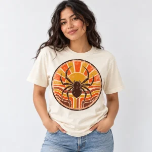 Man wearing cream Retro Spider Badge tee with flared jeans