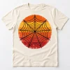 Front flat lay of cream Retro Web Sun retro spider web tee with distressed orange mustard and red circular web graphic
