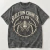 Front flat lay of acid-wash gray Skeleton Crawler Club vintage skeleton spider shirt with bone-white graphic