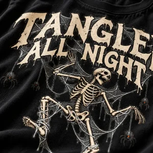 Close-up of skeleton spider shirt print showing distressed bone-white ink, cotton texture, webs and tiny spiders