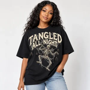 Black American woman wearing black oversized skeleton spider shirt with bone-white dancing skeleton web artwork