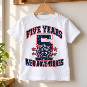 White Kids Spider Balloon Parade birthday tee on wooden hanger showing eight cartoon spiders, colorful balloons and center number 5