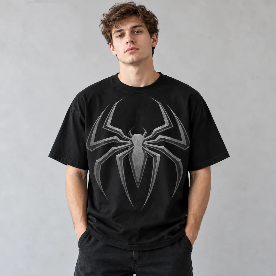 Man wearing black Spider-Man Tonal Emblem tee with dark jeans