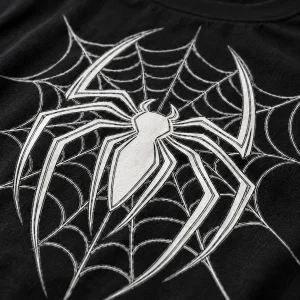 Close-up of white line-art spider emblem with thin web lines