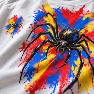 Close-up of Spider Paint Riot print showing black spider, vivid paint splatters and cotton fabric texture