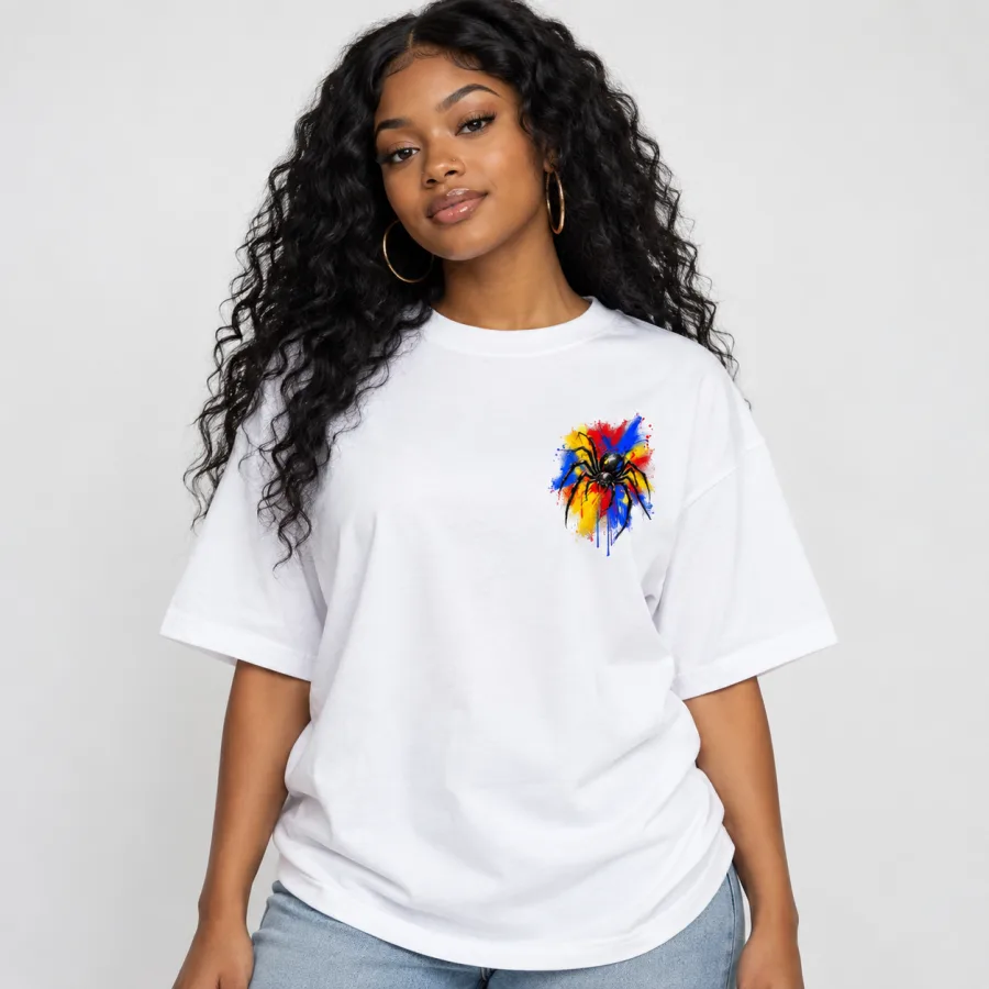 Black female model wearing white Spider Paint Riot oversized tee with small front chest print