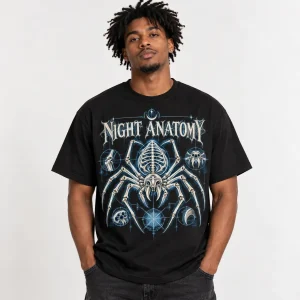Black American male model wearing black skeleton spider Halloween shirt with bone-white and pale blue NIGHT ANATOMY print