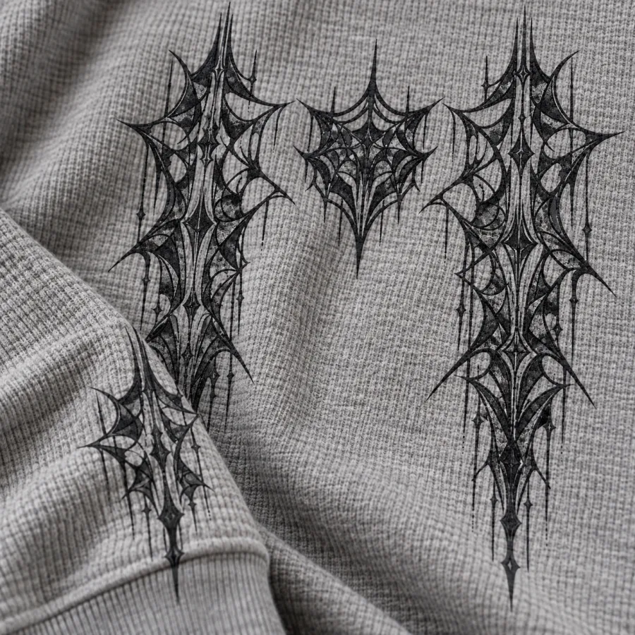 Close-up of dark Thermal Web Grid print on textured Heather gray waffle thermal fabric