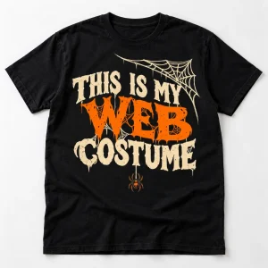 Front flat lay of black funny spider Halloween shirt with This Is My Web Costume cream and orange graphic