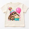 Front flat lay of cream Tiny Party Spider toddler spider birthday shirt with colorful spider, cupcake and balloon design