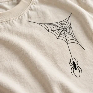 Close-up of the single-line black orb web on natural cotton