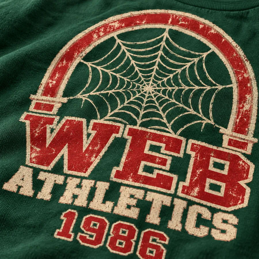 Close-up of weathered cream and red WEB ATHLETICS 1986 lettering and orb web