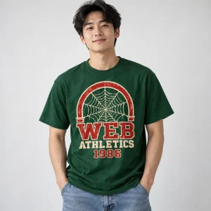 Model wearing forest green Web Athletics 1986 varsity spider web tee