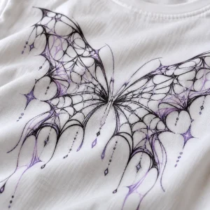 Close-up of Web Butterfly Illusion print showing lavender and black web linework and cotton fabric texture