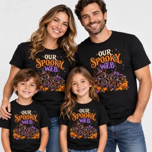 Family wearing matching Black Web Family Halloween shirts with cartoon spiders, pumpkins and colorful lettering