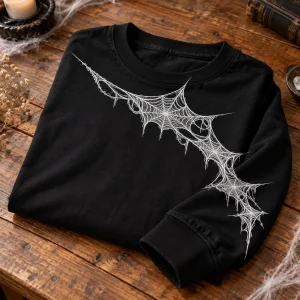 Close-up of white Web Sleeve Crawl web print showing fine line detail and black cotton fabric texture