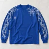 Front flat lay of cobalt blue Web Sleeve System long sleeve with tiny spider